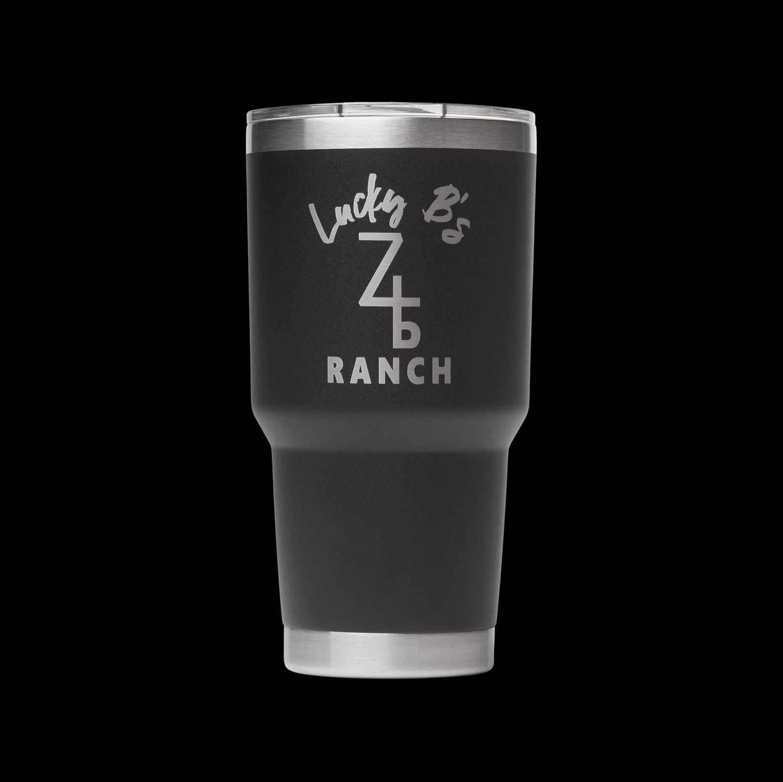 Black 30 oz insulated tumbler laser engraved with a script and cattle-brand style ranch logo in silver.