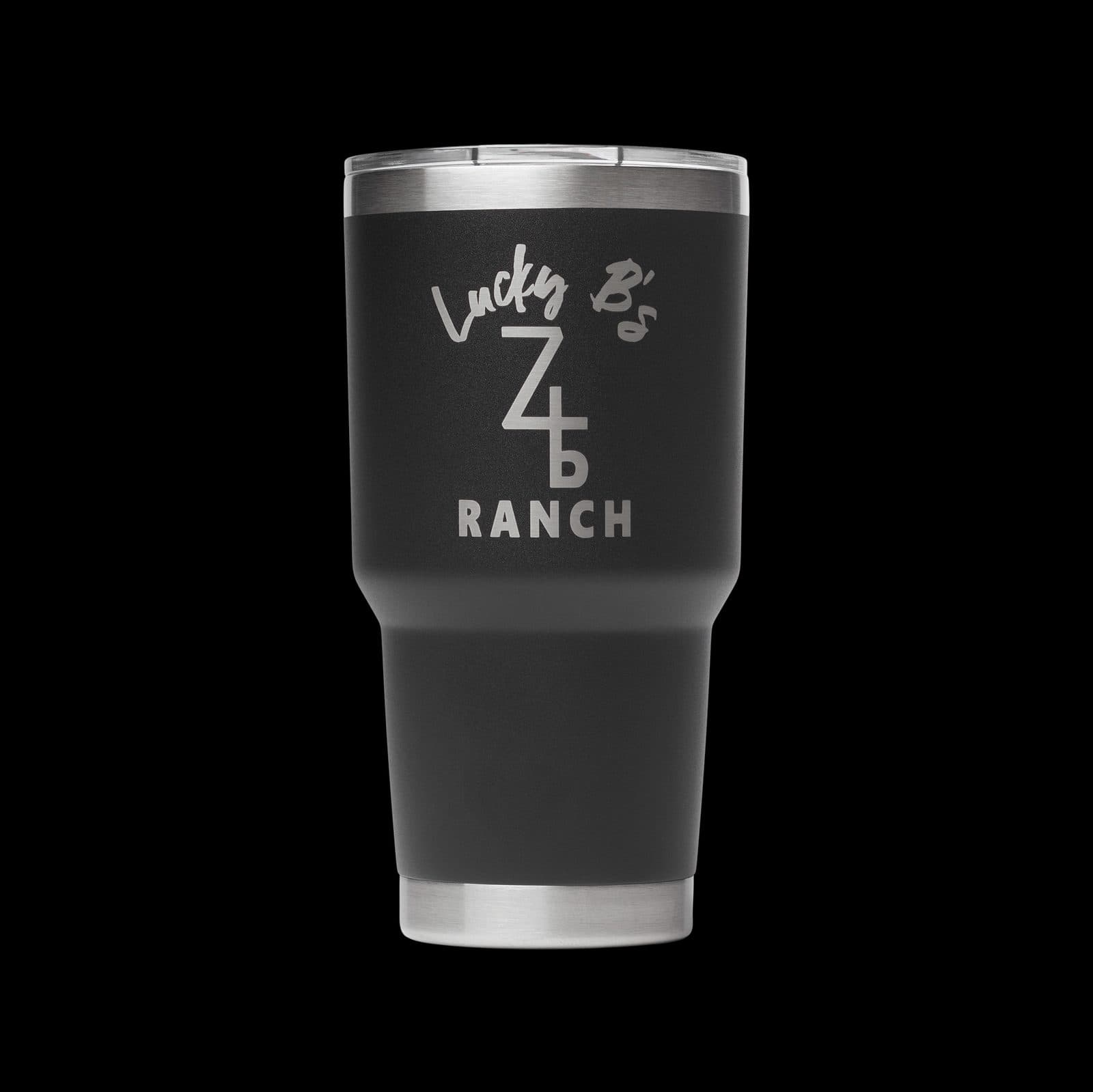 Matte black 30 oz insulated tumbler laser engraved with a ranch logo combining script lettering and a cattle-brand style monogram.